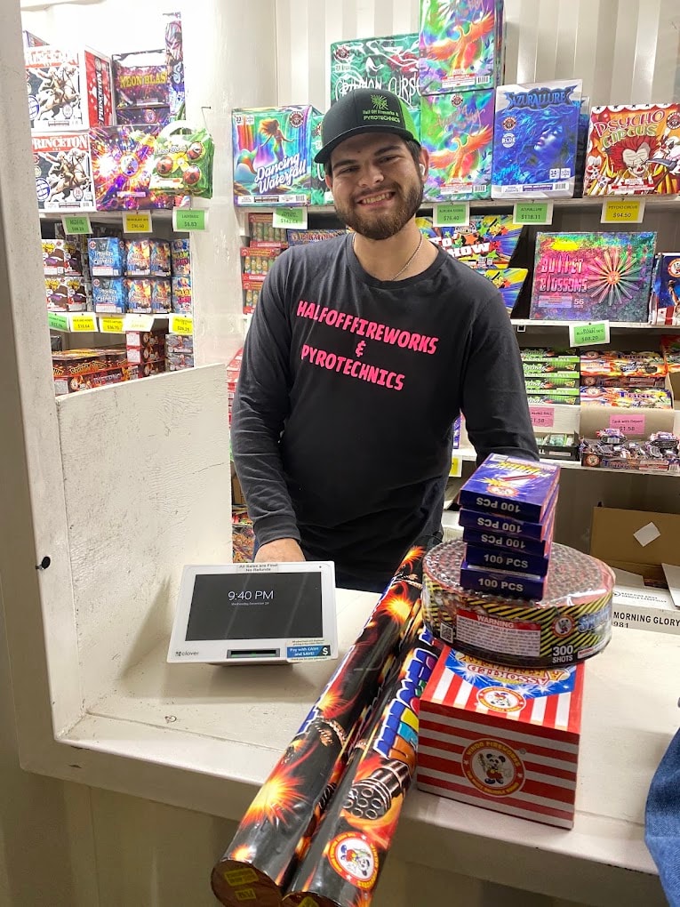Half Off Fireworks staff member at the retail counter